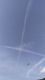 Low angle view of vapor trails in sky