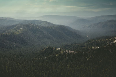 High angle view of land and mountains against sky