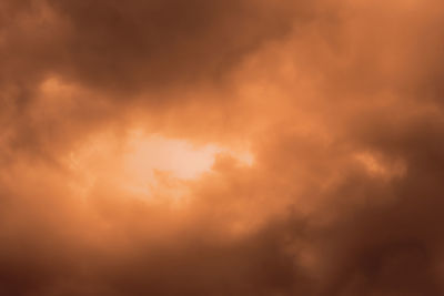 Low angle view of cloudy sky during sunset