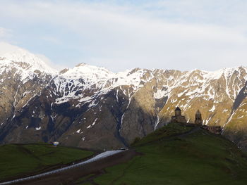 Scenic view of snowcapped mountains against sky