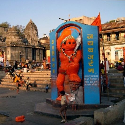 building exterior, architecture, built structure, art and craft, statue, art, sculpture, human representation, creativity, religion, clear sky, famous place, blue, travel destinations, tourism, spirituality, incidental people, tourist