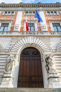 Low angle view of statue against building