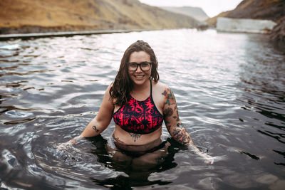 Portrait of young woman in sea