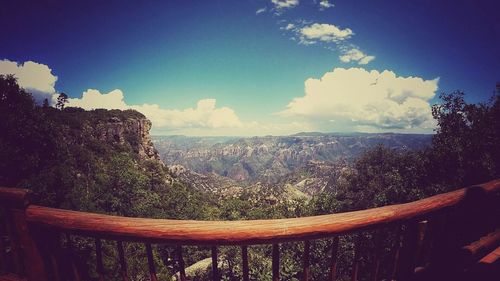 Scenic view of mountains against blue sky