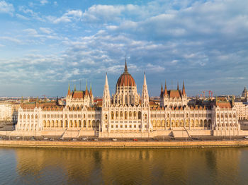 View of budapest iconic hungarian parliament building and danube river from a drone point