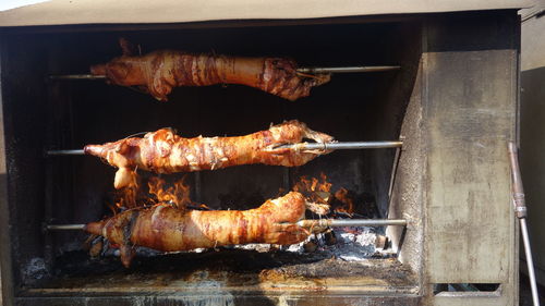High angle view of roast pork on barbecue