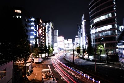 Panoramic view of city street and buildings at night