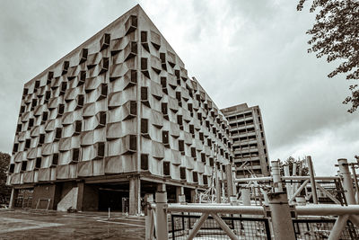 Low angle view of buildings in city against sky