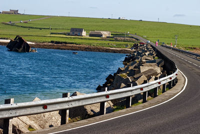 High angle view of road by sea against sky