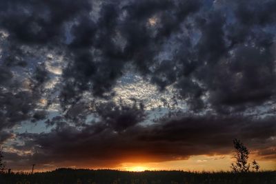 Scenic view of dramatic sky during sunset