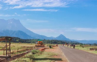 Road amidst landscape against sky
