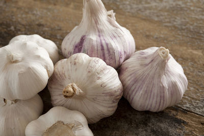 High angle view of garlic on wooden table