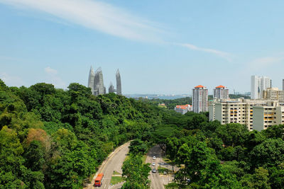 View of trees and buildings against sky