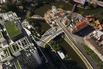 High angle view of buildings and bridge in city