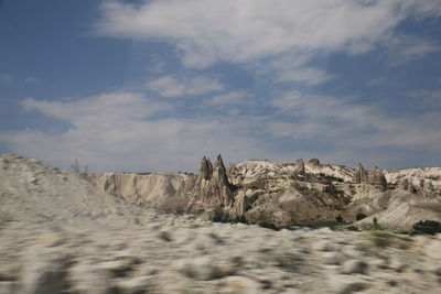 Rock formations in desert against sky