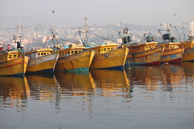 Boats moored in sea