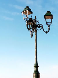 Historic street lamps perfectly framed by the blue sky in angouleme france.