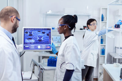 Doctor examining chemical in laboratory