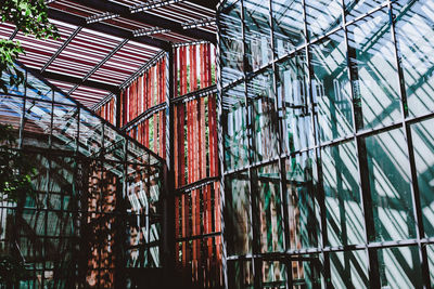 Low angle view of building seen through window