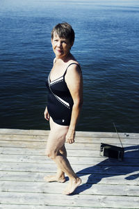 Senior woman standing on jetty