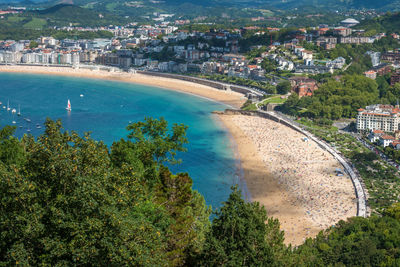 High angle view of buildings by sea