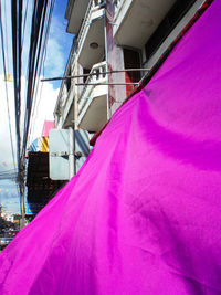 Pink umbrella against sky