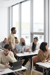 Teacher and adult students in class