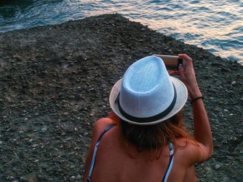Rear view of woman looking at sea
