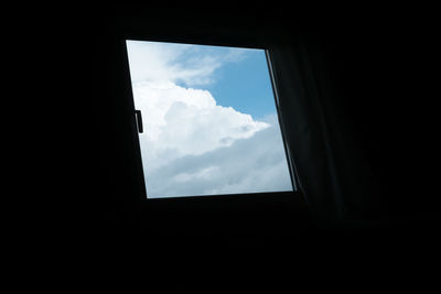Low angle view of sky seen through window