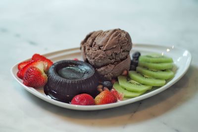 Close-up of fruits in plate on table