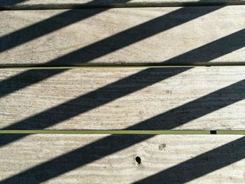 Shadow of zebra crossing on grass