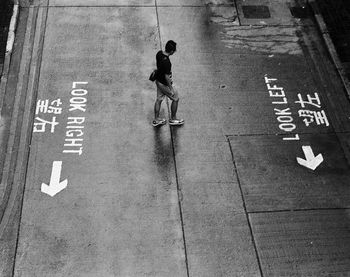 High angle view of man with text on road