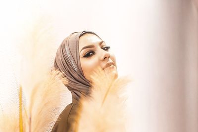 Portrait of young woman in headscarf