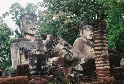 View of buddha statue against trees