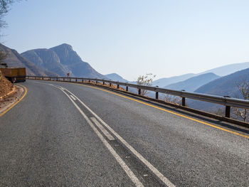 Mountain road in drakensberg mountains against clear sky, south africa