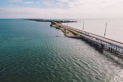 Pier over sea against sky