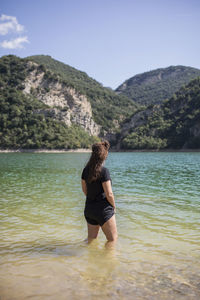 Woman looking away on lake