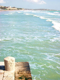 Scenic view of sea against cloudy sky