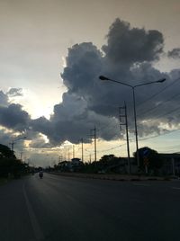 Street against sky during sunset