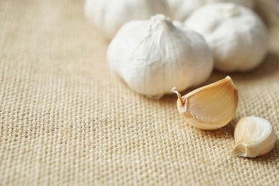 Close-up of white garlic on table