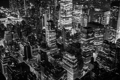 High angle view of modern buildings in city at night
