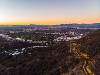 High angle view of buildings against sky during sunset