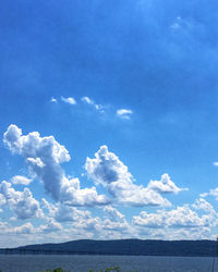 Scenic view of sea against blue sky