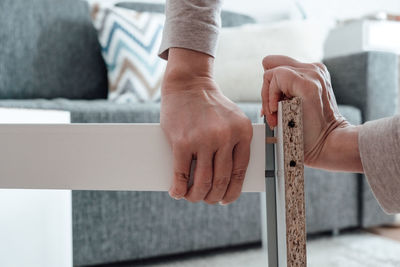 Midsection of man working on table