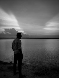 Rear view of man standing on beach