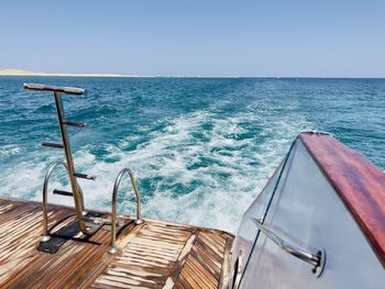 Boat in sea against clear sky