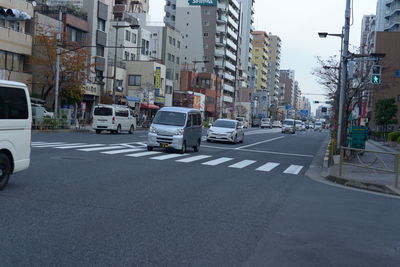 City street and buildings against sky