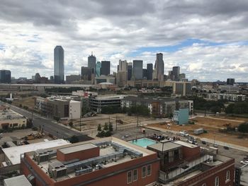 High angle view of buildings in city against sky