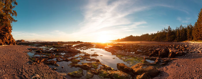 Scenic view of beach against sky during sunset