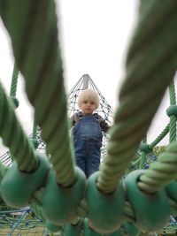 Close-up of cute girl against plants